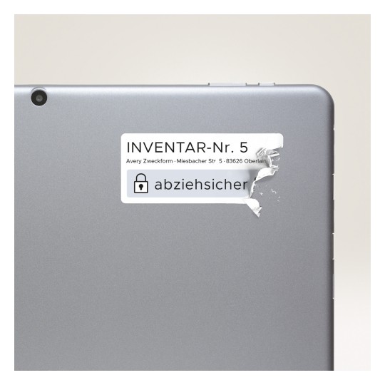 Imaginea prezintă spatele unui dispozitiv cu o etichetă pe care scrie 'INVENTAR-Nr. 5' și include o adresă. Eticheta pare să fie parțial ruptă sau dezlipită.