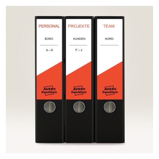 Imaginea arată trei dosare negre cu etichetele: 'PERSONAL', 'PROJEKTE' și 'TEAM'. Fiecare dosar are un design distinctiv roșu și este produs de Avery Zweckform.