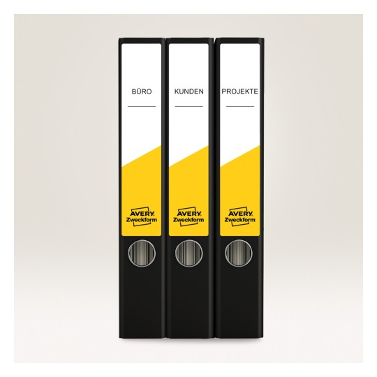 Imaginea prezintă trei dosare negre etichetate 'BÜRO', 'KUNDEN' și 'PROJEKTE' cu un element de design galben, create de Avery Zweckform.