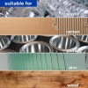 Striped collage of recyclable materials: plastic bottles, cardboard, metal cans, glass panes, and wood