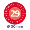 Red circular inspection sticker with number 29 and month markings